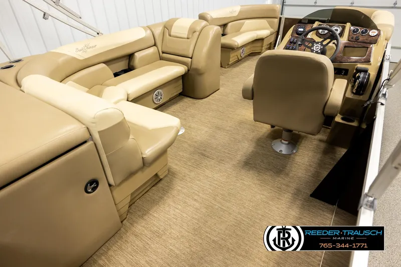 Slide: The Image of Interior of 2022 SunChaser 20 Geneva CRS pontoon boat with tan seating and helm. - 12