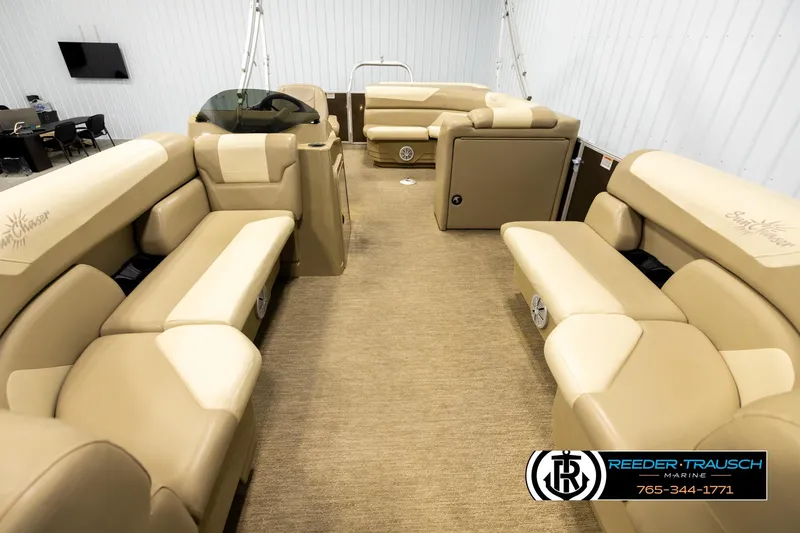 Slide: The Image of 2022 SunChaser 20 Geneva CRS pontoon boat interior with beige seating and carpet flooring. - 13