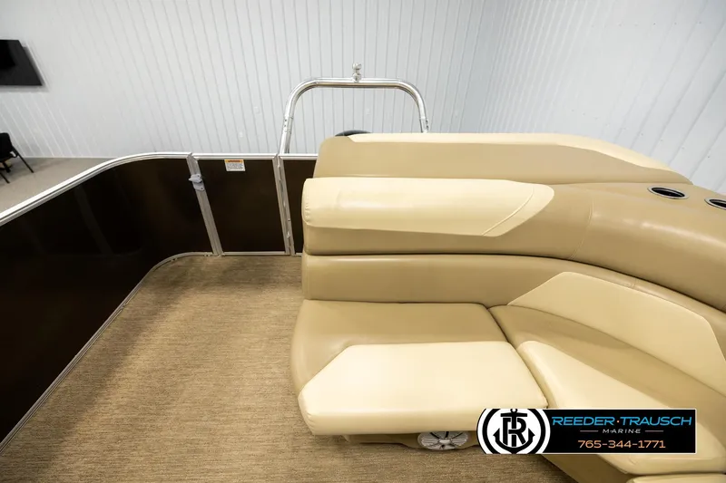 Slide: The Image of 2022 SunChaser 20 Geneva CRS boat interior with beige seating and carpeted floor. - 15