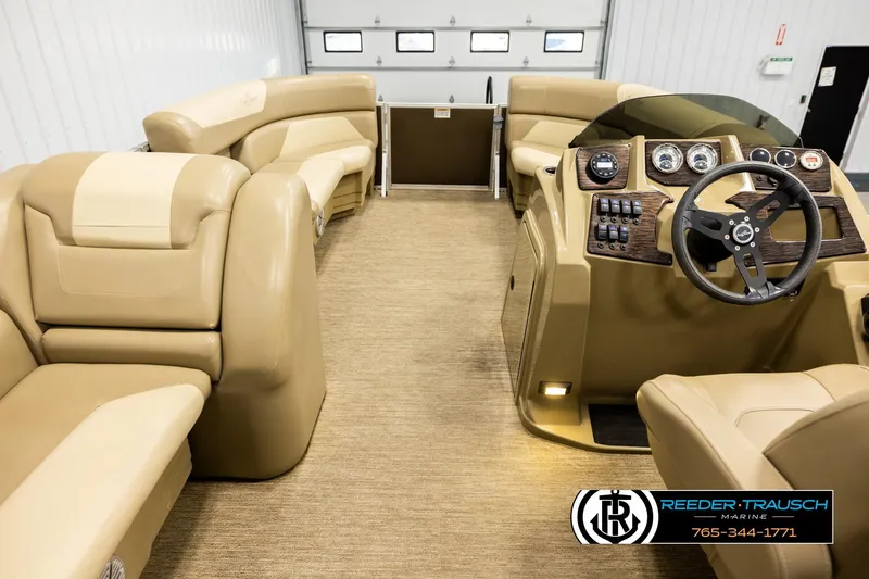 Slide: The Image of Interior of 2022 SunChaser 20 Geneva CRS pontoon boat with beige seating and control panel. - 17