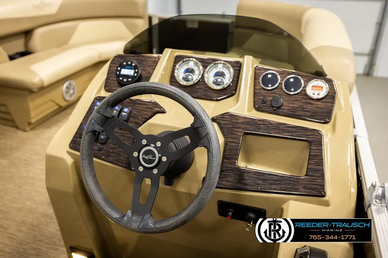 Slide: The Image of 2022 SunChaser 20 Geneva CRS boat dashboard with steering wheel and control panel. - 26