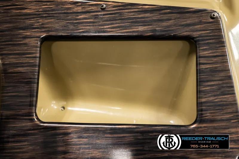 Slide: The Image of Close-up of 2022 SunChaser 20 Geneva CRS boat compartment with wood finish. - 33