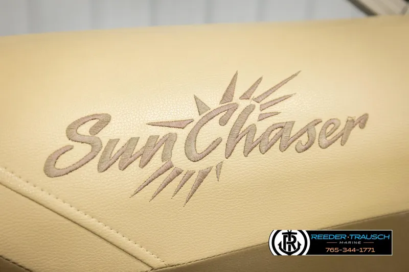 Slide: The Image of SunChaser 20 Geneva CRS 2022 logo on beige upholstery, Reeder-Trausch Marine branding. - 37