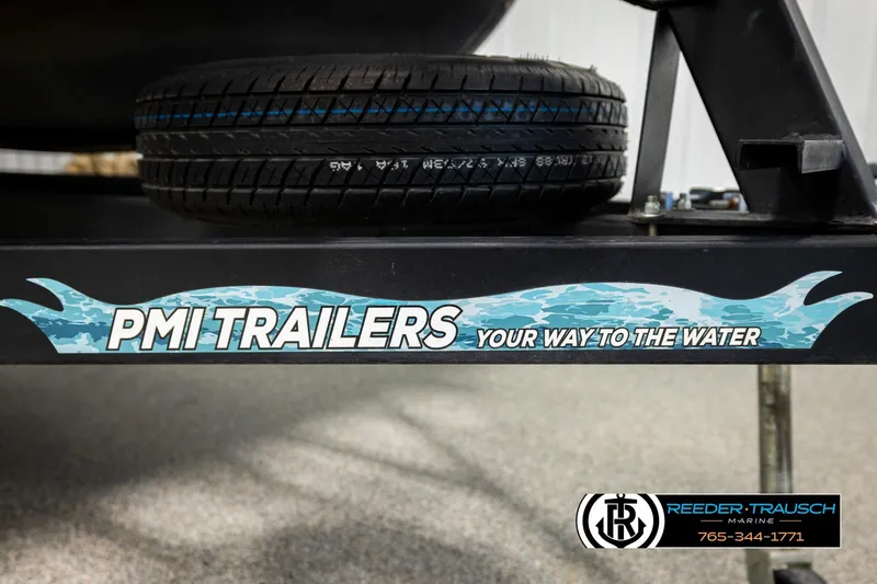Slide: The Image of Trailer with spare tire, featuring PMI Trailers branding and Reeder-Trausch Marine contact information. - 46