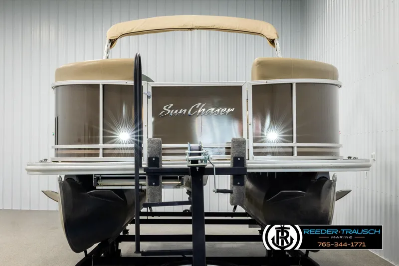 Slide: The Image of 2022 SunChaser 20 Geneva CRS pontoon boat on display in a showroom. - 8