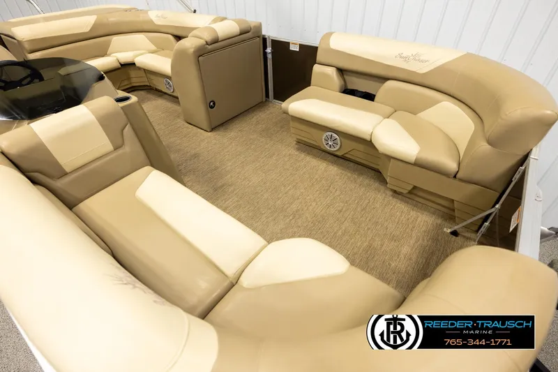 Slide: The Image of Luxurious interior of 2022 SunChaser 20 Geneva CRS pontoon boat with beige seating. - 9