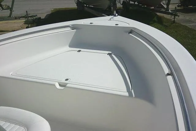 Slide: The Image of 2014 Tidewater 196 CC Adventure boat bow with storage compartment and railings. - 10