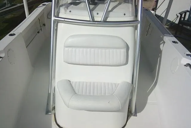 Slide: The Image of 2014 Tidewater 196 CC Adventure boat interior with white cushioned seating. - 11