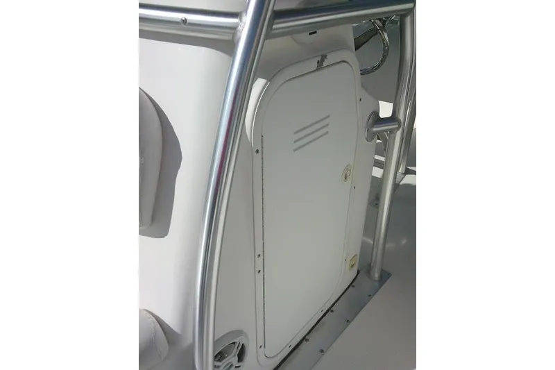 Slide: The Image of 2014 Tidewater 196 CC Adventure boat console with storage compartment and railing. - 12