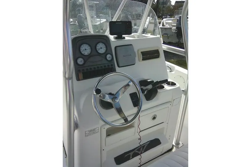 Slide: The Image of 2014 Tidewater 196 CC Adventure boat console with steering wheel and gauges. - 15