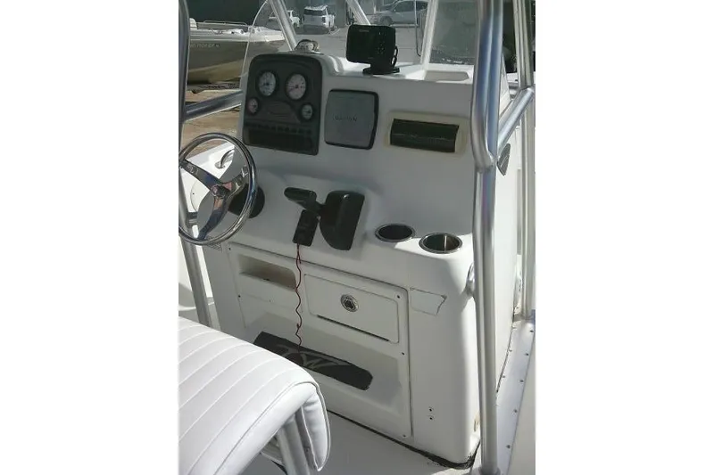 Slide: The Image of 2014 Tidewater 196 CC Adventure boat console with steering wheel and gauges. - 18