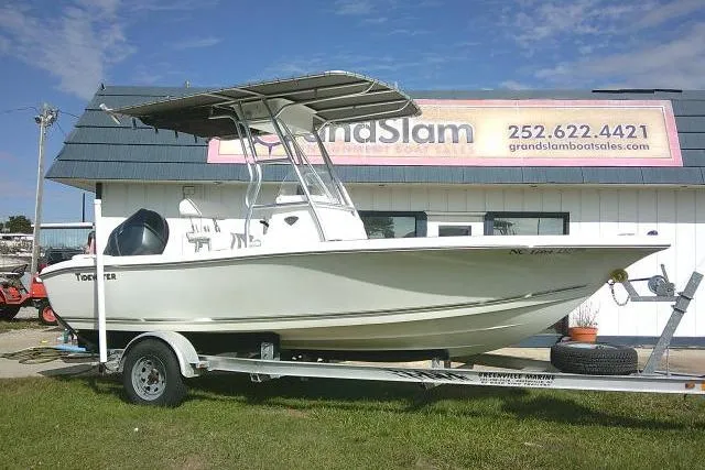 Slide: The Image of 2014 Tidewater 196 CC Adventure boat on trailer outside dealership. - 2
