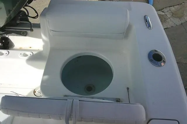 Slide: The Image of 2014 Tidewater 196 CC Adventure boat's seating and storage area. - 23