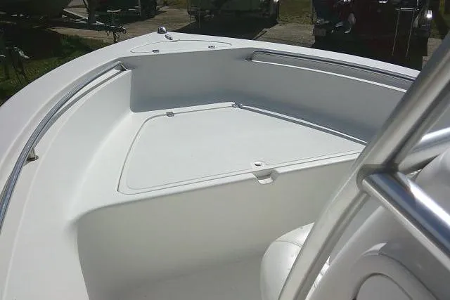 Slide: The Image of 2014 Tidewater 196 CC Adventure boat, white deck view with stainless steel railings. - 8