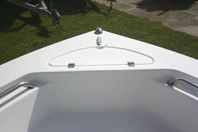 Slide: The Image of 2014 Tidewater 196 CC Adventure boat bow with storage compartment and stainless steel rails. - 9