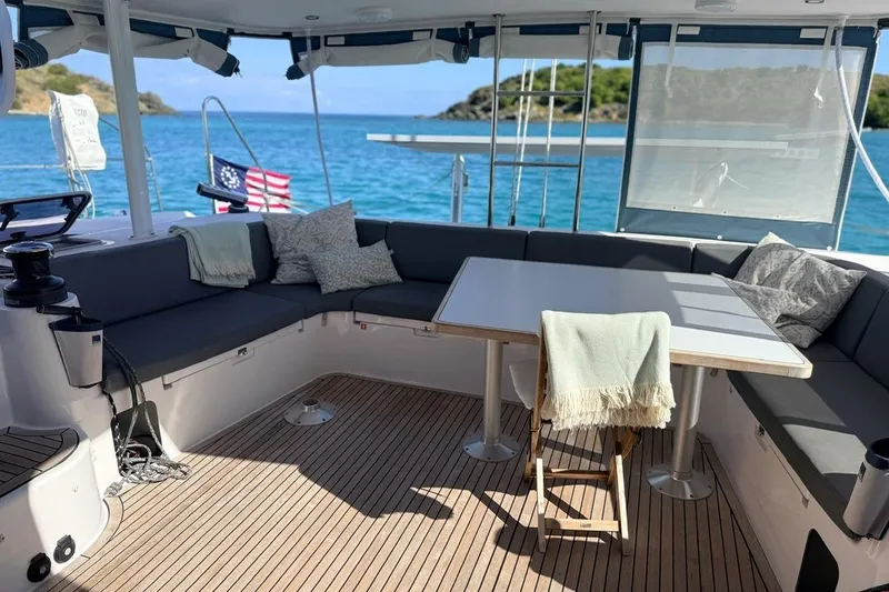 Slide: The Image of Luxurious 2021 Outremer 51 yacht interior with cozy seating and ocean view. - 10