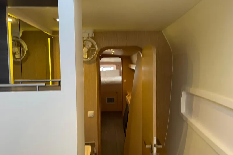 Slide: The Image of Interior view of 2021 Outremer 51 yacht, featuring modern design and cozy cabin space. - 14