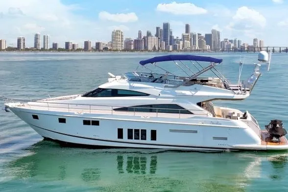 The Image of 2013 Fairline Squadron 66 yacht cruising near a city skyline. - 1