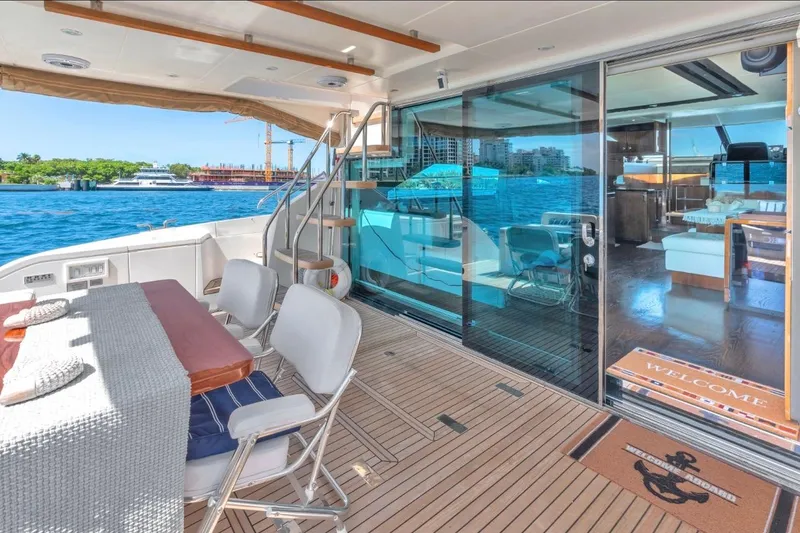 Slide: The Image of Luxurious 2013 Fairline Squadron 66 yacht with elegant outdoor seating and ocean view. - 16