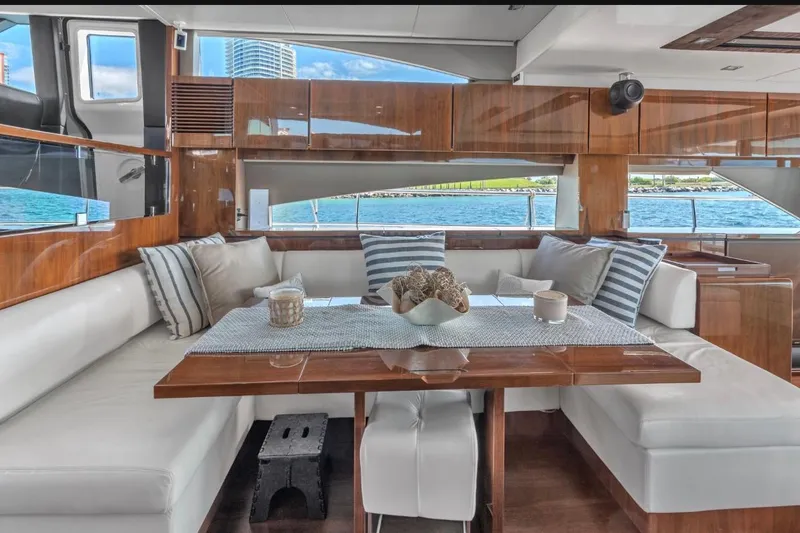 Slide: The Image of Luxurious interior of 2013 Fairline Squadron 66 yacht with elegant seating and ocean view. - 9