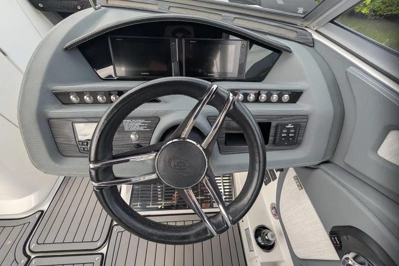 Slide: The Image of 2021 Cobalt R7 boat dashboard with steering wheel and control panels. - 6