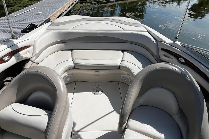 Slide: The Image of 2003 Sea Ray 240 Bow Rider interior with plush seating and elegant design. - 7