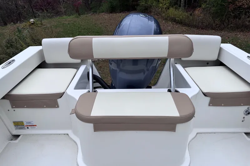 Slide: The Image of 2018 Parker 2120 Sport Cabin boat seating and engine view. - 5