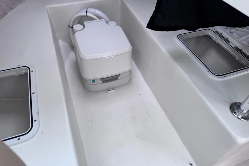 Slide: The Image of Portable toilet in 2018 Parker 2120 Sport Cabin boat interior. - 6
