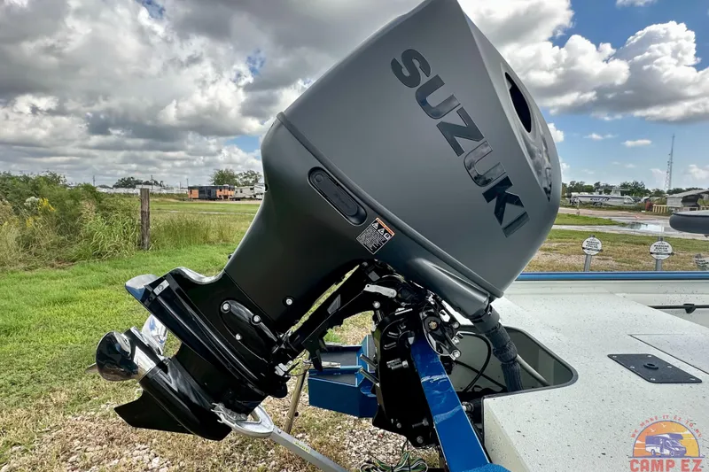 Slide: The Image of 2026 SeaArk C1074 Shadow 18TCC with Suzuki outboard motor, parked outdoors. - 8