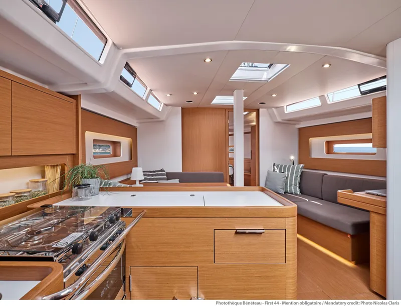 Slide: The Image of Luxurious interior of 2025 Beneteau First 44 yacht with modern kitchen and seating area. - 5