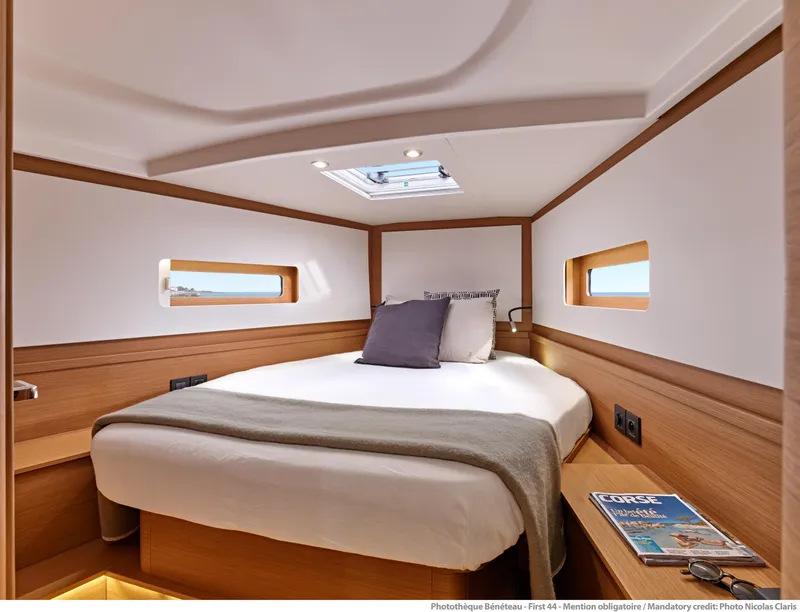 Slide: The Image of Luxurious cabin interior of 2025 Beneteau First 44 yacht, featuring cozy bed and modern design. - 8