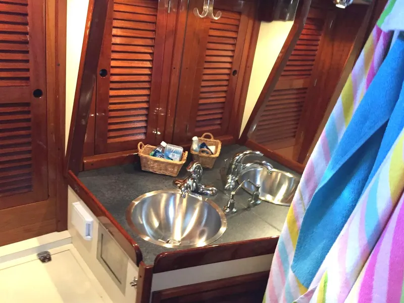 Slide: The Image of 1979 Tartan 37C yacht bathroom with wooden cabinets and stainless steel sink. - 19