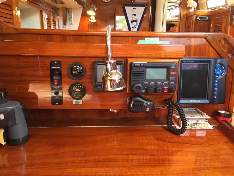 Slide: The Image of Navigation equipment on a 1979 Tartan 37C sailboat with wood paneling. - 21
