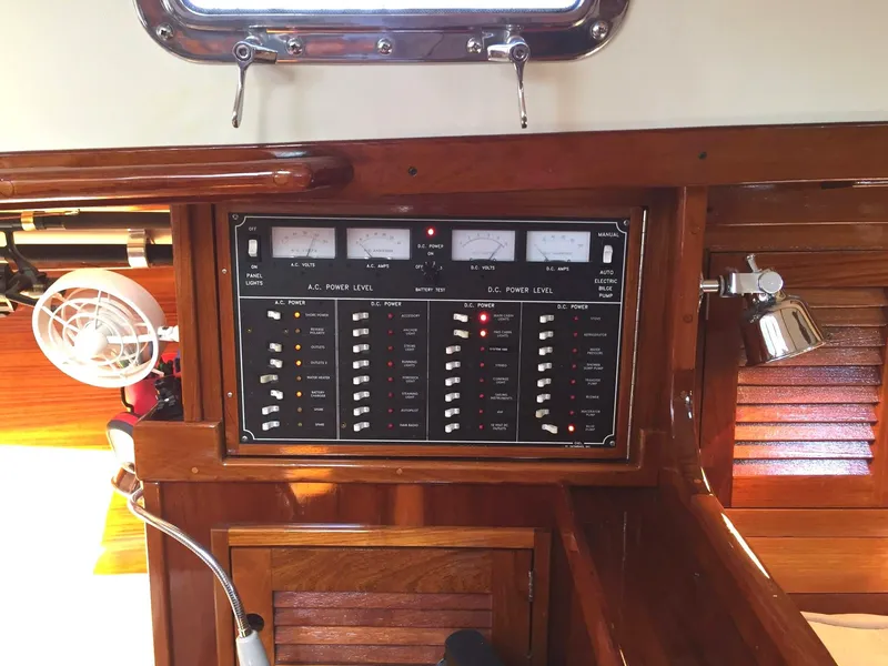 Slide: The Image of Electrical panel on a 1979 Tartan 37C sailboat, featuring gauges and switches. - 23