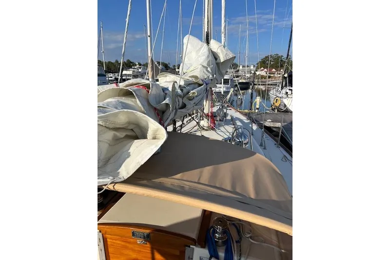 Slide: The Image of 1979 Tartan 37C sailboat with sails down, docked in a marina. - 33