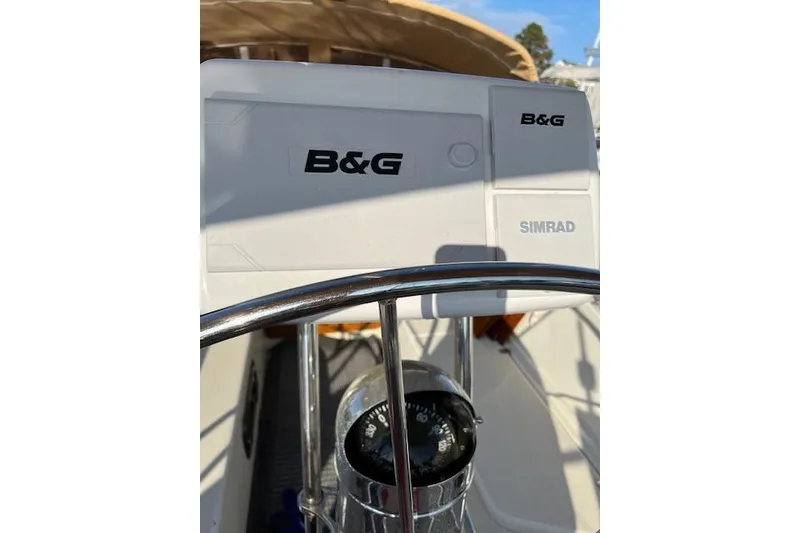 Slide: The Image of Steering wheel and navigation equipment on a 1979 Tartan 37C sailboat. - 34
