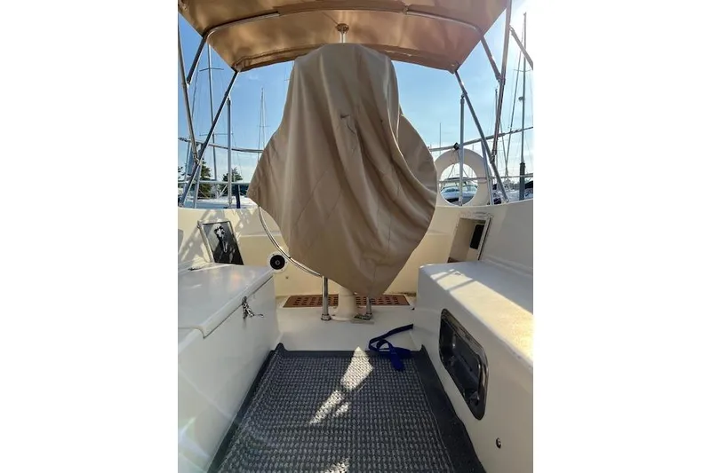 Slide: The Image of 1979 Tartan 37C sailboat cockpit with covered wheel and canopy. - 38