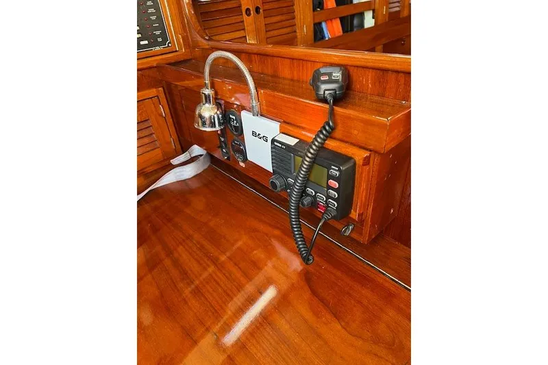 Slide: The Image of 1979 Tartan 37C yacht interior with navigation equipment and wooden finish. - 40