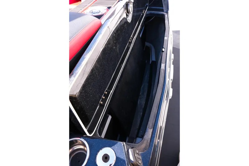 Slide: The Image of 2022 Supra SL boat storage compartment with sleek design and ample space. - 11