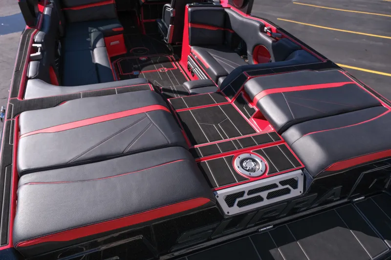Slide: The Image of 2022 Supra SL boat interior with black and red seating, modern design. - 12
