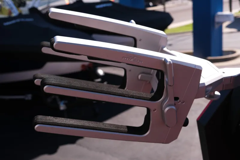 Slide: The Image of 2022 Supra SL boat accessory, close-up of a wakeboard rack in sunlight. - 16