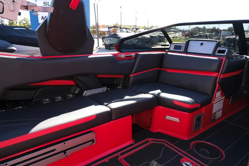Slide: The Image of Luxurious interior of 2022 Supra SL boat with sleek black and red seating. - 18