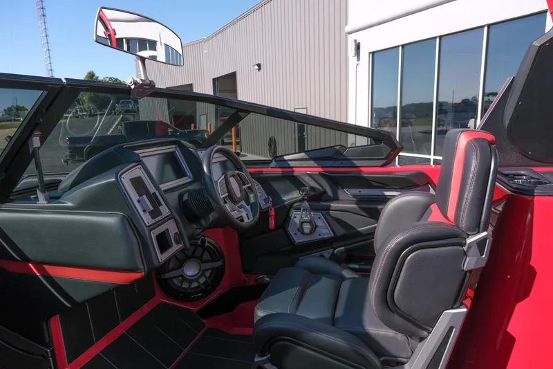 Slide: The Image of 2022 Supra SL interior, featuring sleek black and red design with modern controls and comfortable seating. - 20