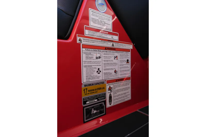 Slide: The Image of Warning labels on 2022 Supra SL boat, detailing safety instructions and maximum capacity. - 25
