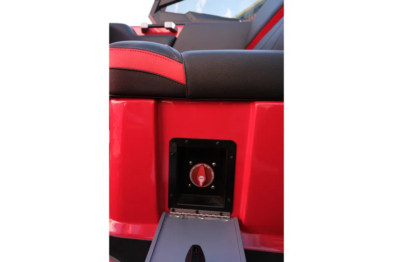 Slide: The Image of 2022 Supra SL interior detail with red and black seating and control panel. - 26