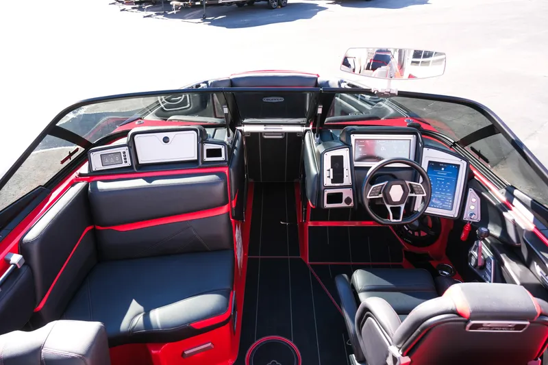 Slide: The Image of 2022 Supra SL boat interior with modern dashboard, steering wheel, and seating. - 30