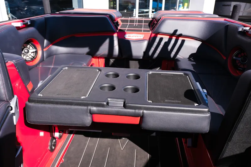 Slide: The Image of 2022 Supra SL boat interior with seating and cup holders. - 31