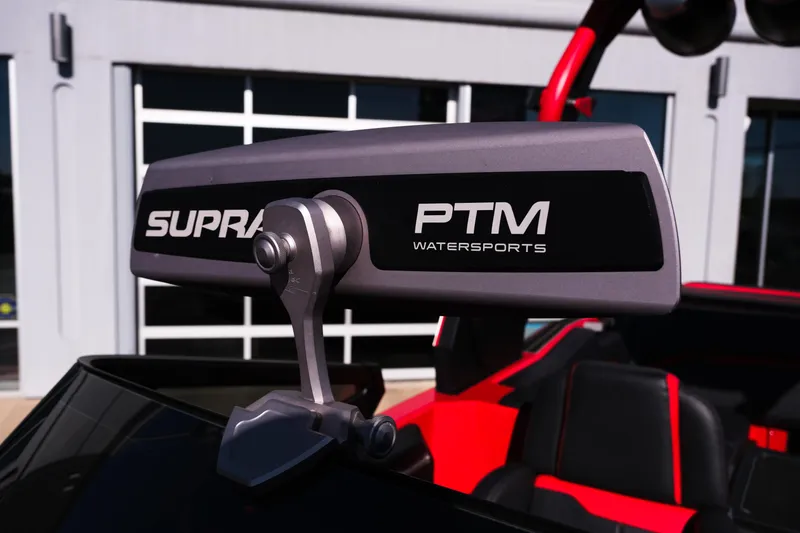 Slide: The Image of 2022 Supra SL PTM Watersports mirror on a red boat, close-up view. - 35