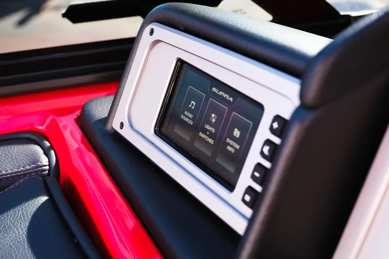 Slide: The Image of 2022 Supra SL dashboard touchscreen displaying audio, lights, and system info options. - 36