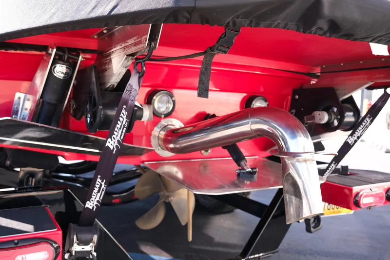 Slide: The Image of Rear view of a 2022 Supra SL boat with exhaust and propeller details. - 6